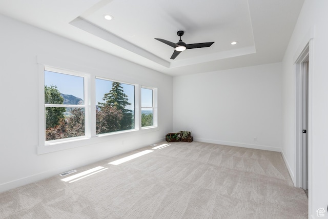 3616 N 600 E, North Ogden, UT 84414 - spare room with a raised ceiling, light colored carpet, recessed lighting, ceiling fan, and baseboards