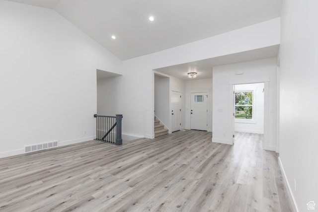 3616 N 600 E, North Ogden, UT 84414 - spare room featuring light wood-type flooring, baseboards, stairs, recessed lighting, and high vaulted ceiling