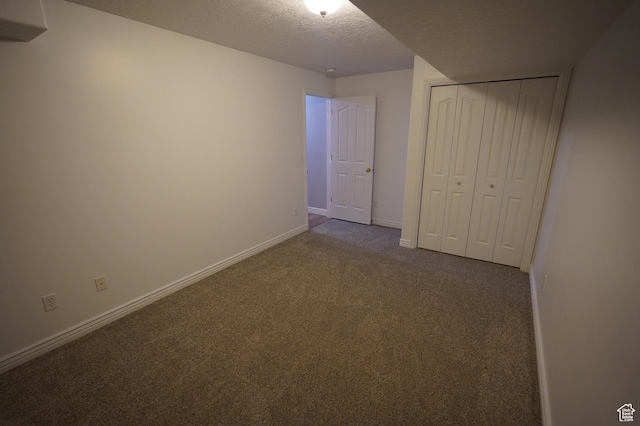 2881 N 450 E, North Ogden, UT 84414 - unfurnished bedroom with carpet, a textured ceiling, baseboards, and a closet