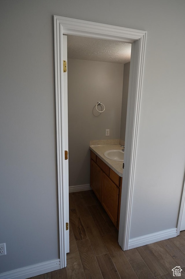 2881 N 450 E, North Ogden, UT 84414 - bathroom with wood finished floors, vanity, and baseboards