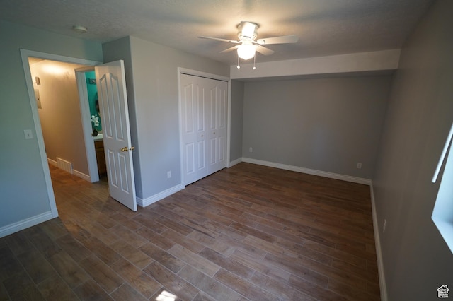 2881 N 450 E, North Ogden, UT 84414 - unfurnished bedroom with baseboards, dark wood-style floors, a closet, and a ceiling fan