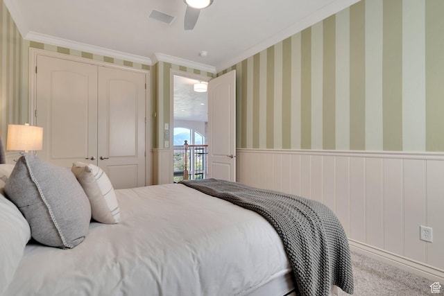 14709 S Cedar Knoll Cir, Herriman, UT 84096 - bedroom with crown molding, wainscoting, and ceiling fan