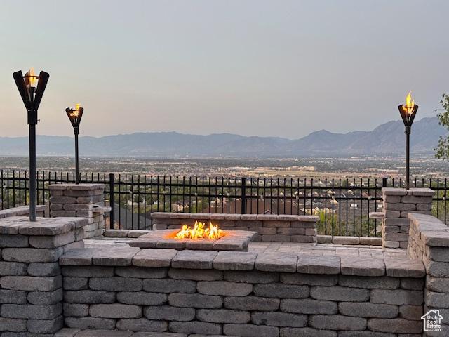 14709 S Cedar Knoll Cir, Herriman, UT 84096 - view of patio / terrace with an outdoor fire pit and a mountain view