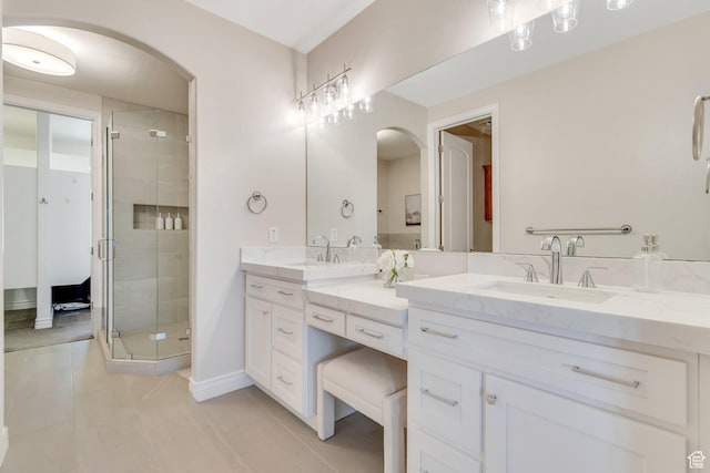 14709 S Cedar Knoll Cir, Herriman, UT 84096 - bathroom with double vanity, tile patterned flooring, a shower stall, and baseboards