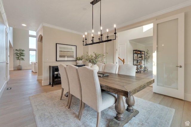 14709 S Cedar Knoll Cir, Herriman, UT 84096 - dining room featuring ornamental molding, light wood-type flooring, recessed lighting, baseboards, and arched walkways