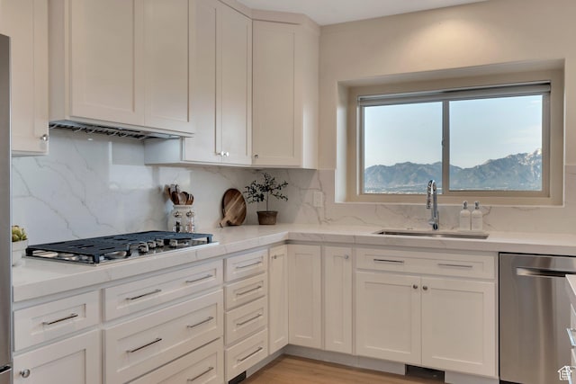 14709 S Cedar Knoll Cir, Herriman, UT 84096 - kitchen with appliances with stainless steel finishes, a sink, and white cabinets