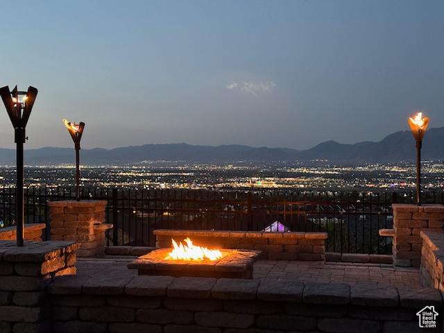 14709 S Cedar Knoll Cir, Herriman, UT 84096 - view of patio / terrace with an outdoor fire pit and a mountain view