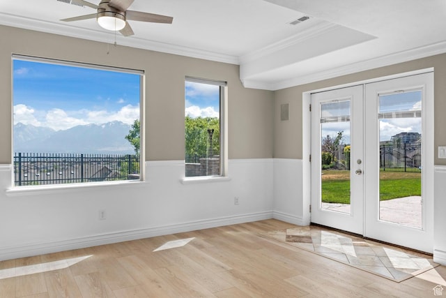 14709 S Cedar Knoll Cir, Herriman, UT 84096 - unfurnished room featuring french doors, light wood finished floors, crown molding, a ceiling fan, and a mountain view