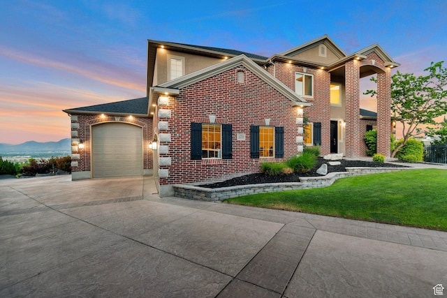 14709 S Cedar Knoll Cir, Herriman, UT 84096 - view of front of house featuring concrete driveway, brick siding, a front yard, and a garage