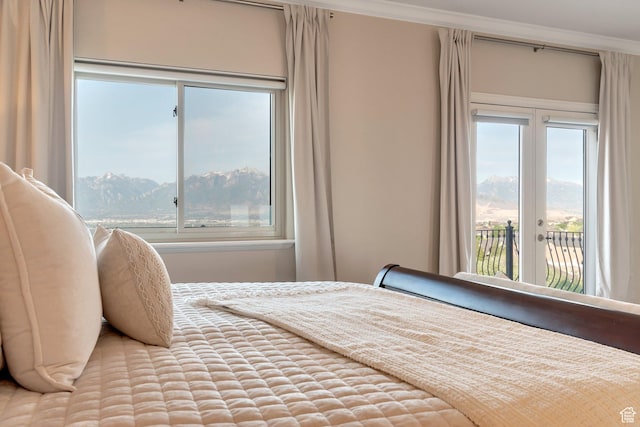 14709 S Cedar Knoll Cir, Herriman, UT 84096 - bedroom with access to exterior, multiple windows, a mountain view, crown molding, and french doors