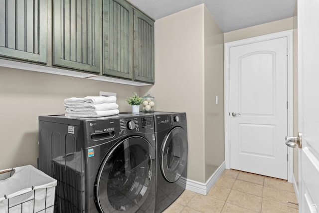 14709 S Cedar Knoll Cir, Herriman, UT 84096 - laundry area featuring cabinet space, washer and clothes dryer, baseboards, and light tile patterned flooring