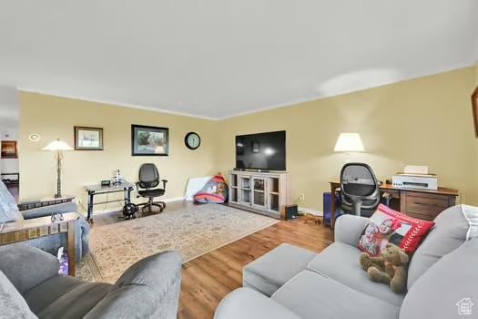 1785 29th St Unit 504, Ogden, UT 84403 - living room featuring wood finished floors and baseboards