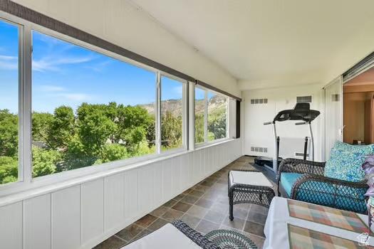 1785 29th St Unit 504, Ogden, UT 84403 - sunroom / solarium featuring stone finish flooring and an outdoor living space