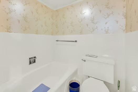 1785 29th St Unit 504, Ogden, UT 84403 - bathroom featuring wallpapered walls, toilet, and a bath