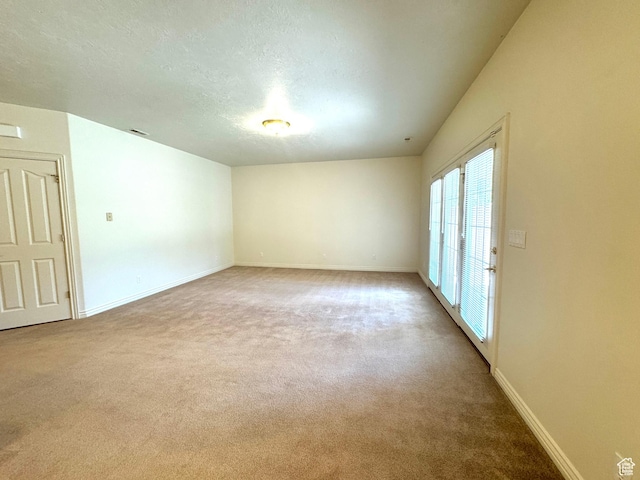 362 S Glen Cir E, Fruit Heights, UT 84037 - empty room featuring carpet, baseboards, and a textured ceiling