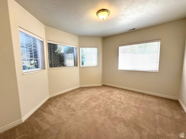 362 S Glen Cir E, Fruit Heights, UT 84037 - carpeted spare room with baseboards and a textured ceiling