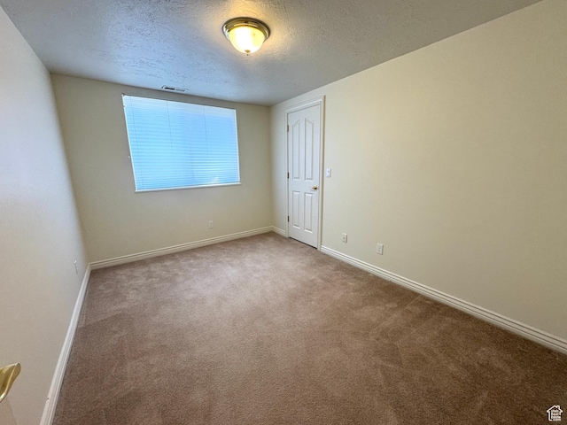 362 S Glen Cir E, Fruit Heights, UT 84037 - carpeted empty room featuring a textured ceiling and baseboards