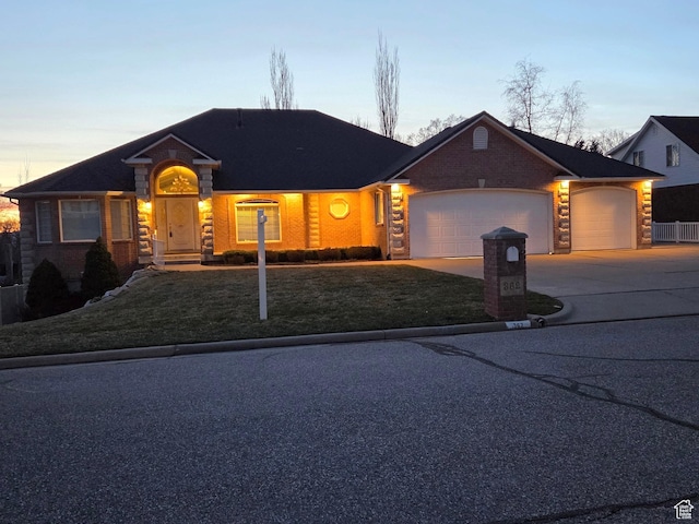 362 S Glen Cir E, Fruit Heights, UT 84037 - view of front of house with a garage, concrete driveway, and a yard