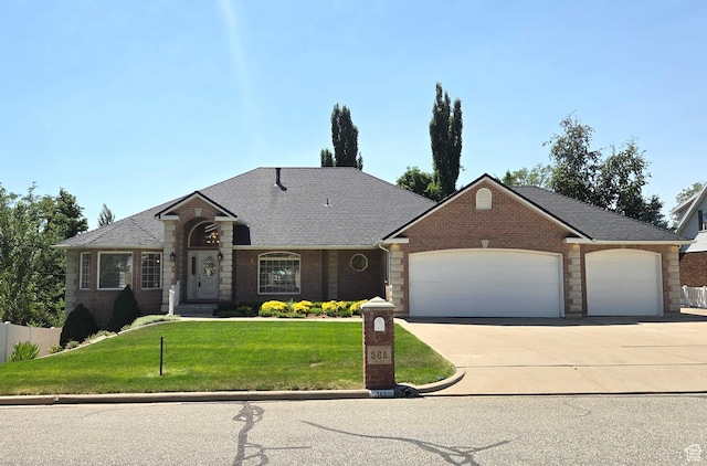 362 S Glen Cir E, Fruit Heights, UT 84037 - view of front of house with an attached garage, driveway, brick siding, and a shingled roof