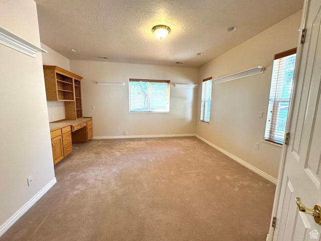 362 S Glen Cir E, Fruit Heights, UT 84037 - unfurnished bedroom with a textured ceiling, light colored carpet, and baseboards