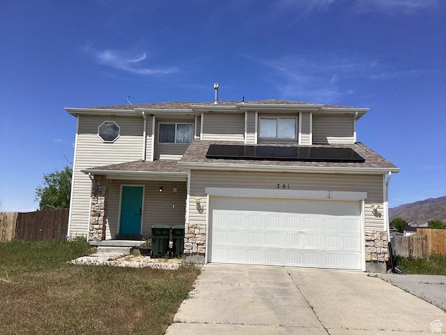 781 E Valley View Dr, Tooele, UT 84074 - traditional home featuring concrete driveway, an attached garage, and stone siding