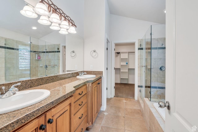 719 E Hampton Ct N, Alpine, UT 84004 - bathroom featuring a shower stall, double vanity, a walk in closet, and tile patterned floors
