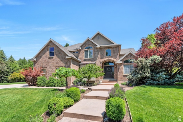 719 E Hampton Ct N, Alpine, UT 84004 - view of front facade with a front lawn and brick siding