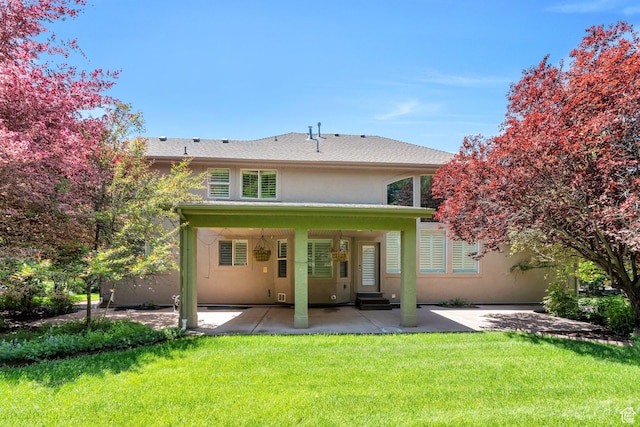 719 E Hampton Ct N, Alpine, UT 84004 - back of property featuring stucco siding, a patio, a yard, and entry steps