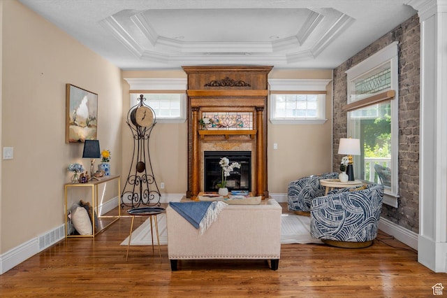 521 E 900 S, Salt Lake City, UT 84105 - living room with wood finished floors, a fireplace, baseboards, ornamental molding, and a tray ceiling