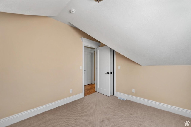 521 E 900 S, Salt Lake City, UT 84105 - bonus room with light colored carpet, vaulted ceiling, and baseboards