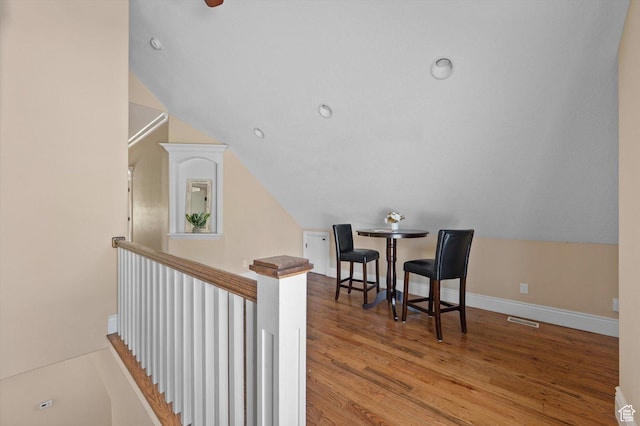 521 E 900 S, Salt Lake City, UT 84105 - corridor with wood finished floors, baseboards, vaulted ceiling, and an upstairs landing