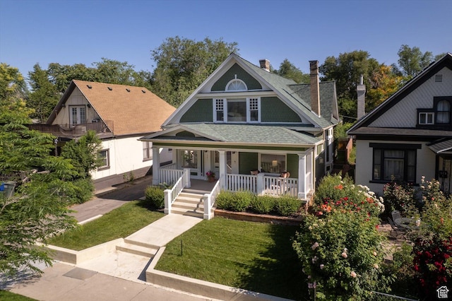 521 E 900 S, Salt Lake City, UT 84105 - view of front of home with a chimney, a porch, a front lawn, and roof with shingles