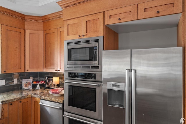 521 E 900 S, Salt Lake City, UT 84105 - kitchen with appliances with stainless steel finishes, backsplash, brown cabinets, and crown molding