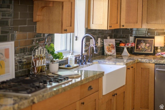 521 E 900 S, Salt Lake City, UT 84105 - kitchen with stainless steel appliances, a sink, backsplash, and brown cabinetry