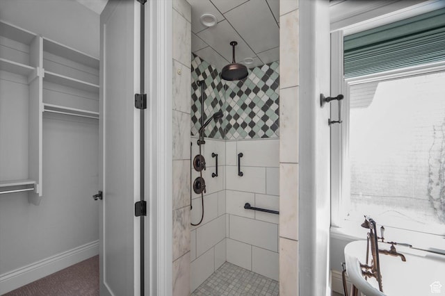 521 E 900 S, Salt Lake City, UT 84105 - bathroom featuring a shower stall, a soaking tub, a spacious closet, and baseboards