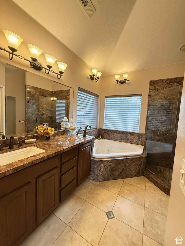 639 N 1550 E, Price, UT 84501 - full bathroom featuring tiled shower, a whirlpool tub, double vanity, vaulted ceiling, and tile patterned floors