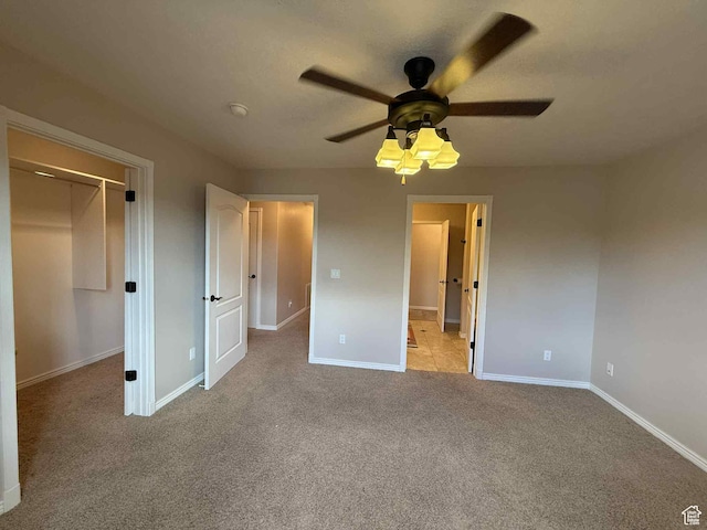 639 N 1550 E, Price, UT 84501 - unfurnished bedroom with light colored carpet, baseboards, a closet, and ceiling fan