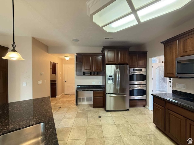 639 N 1550 E, Price, UT 84501 - kitchen featuring stainless steel appliances, dark brown cabinets, dark stone counters, pendant lighting, and light tile patterned floors