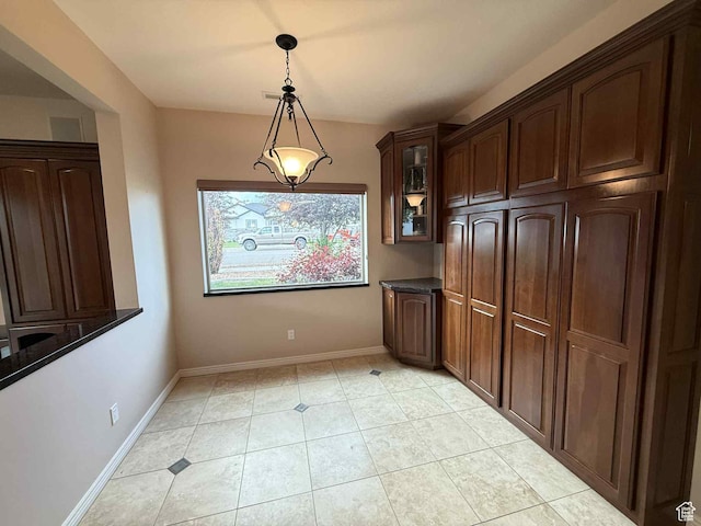 639 N 1550 E, Price, UT 84501 - unfurnished dining area featuring baseboards and light tile patterned floors