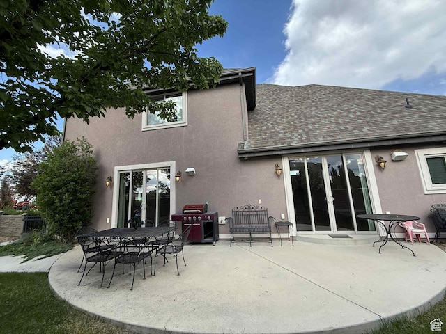 639 N 1550 E, Price, UT 84501 - back of property with stucco siding, a patio area, and a shingled roof