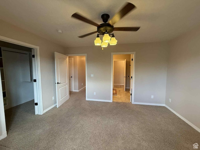 639 N 1550 E, Price, UT 84501 - unfurnished bedroom with baseboards, carpet, a spacious closet, and ceiling fan
