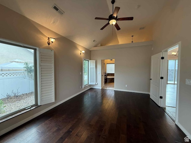639 N 1550 E, Price, UT 84501 - unfurnished living room featuring dark wood-style flooring, healthy amount of natural light, and high vaulted ceiling