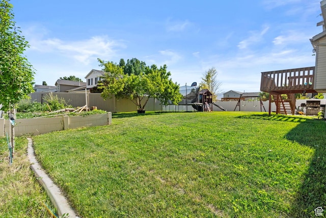 2456 W 1600 N, Clinton, UT 84015 - view of yard with a playground, a vegetable garden, stairs, and a deck