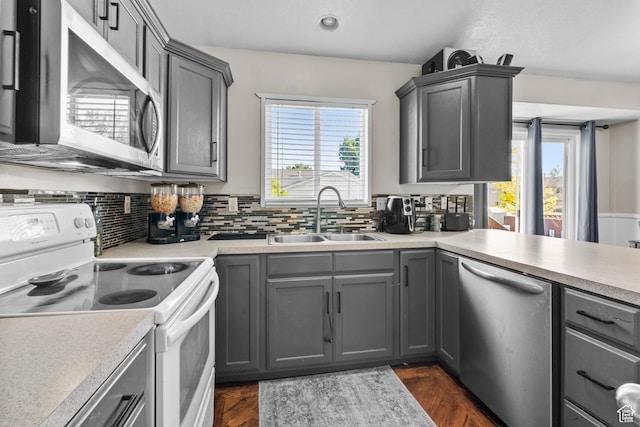 2456 W 1600 N, Clinton, UT 84015 - kitchen featuring stainless steel appliances, a sink, gray cabinets, healthy amount of natural light, and recessed lighting
