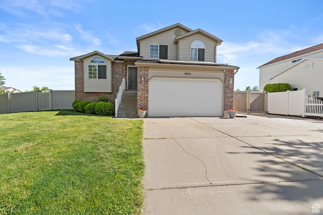2456 W 1600 N, Clinton, UT 84015 - view of front of property with concrete driveway, brick siding, and an attached garage