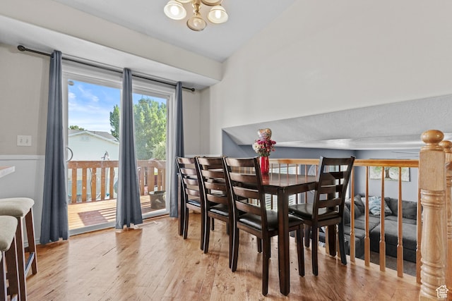 2456 W 1600 N, Clinton, UT 84015 - dining room featuring healthy amount of natural light, wood finished floors, and a chandelier