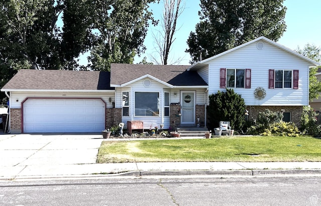 497 W 2280 N, Lehi, UT 84043 - tri-level home with a garage, brick siding, concrete driveway, and a front lawn