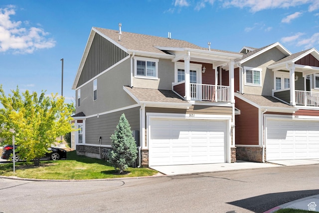 901 E 775 N, Layton, UT 84041 - view of front facade with an attached garage, stone siding, a shingled roof, and driveway