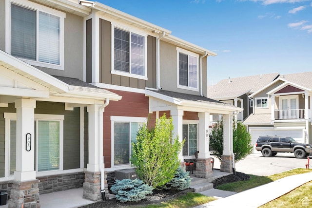 901 E 775 N, Layton, UT 84041 - view of front facade featuring a porch, stone siding, board and batten siding, and central AC unit