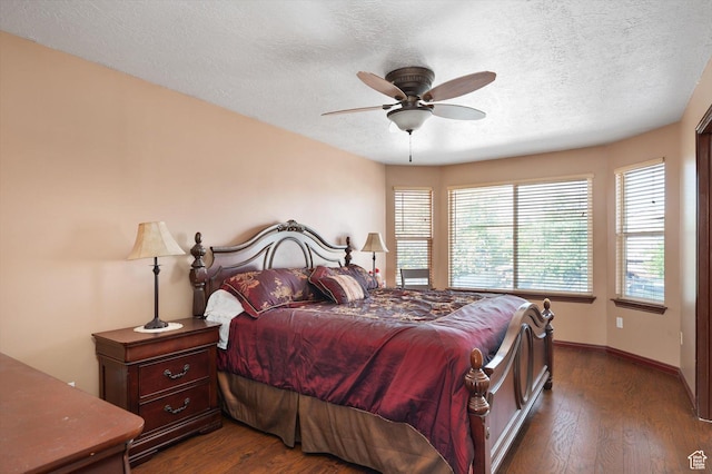 3139 S Timeron Dr, West Valley City, UT 84128 - bedroom with dark wood-style flooring, a textured ceiling, baseboards, and ceiling fan